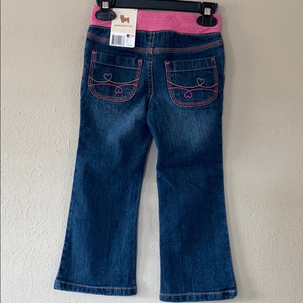 jeans with pink belt